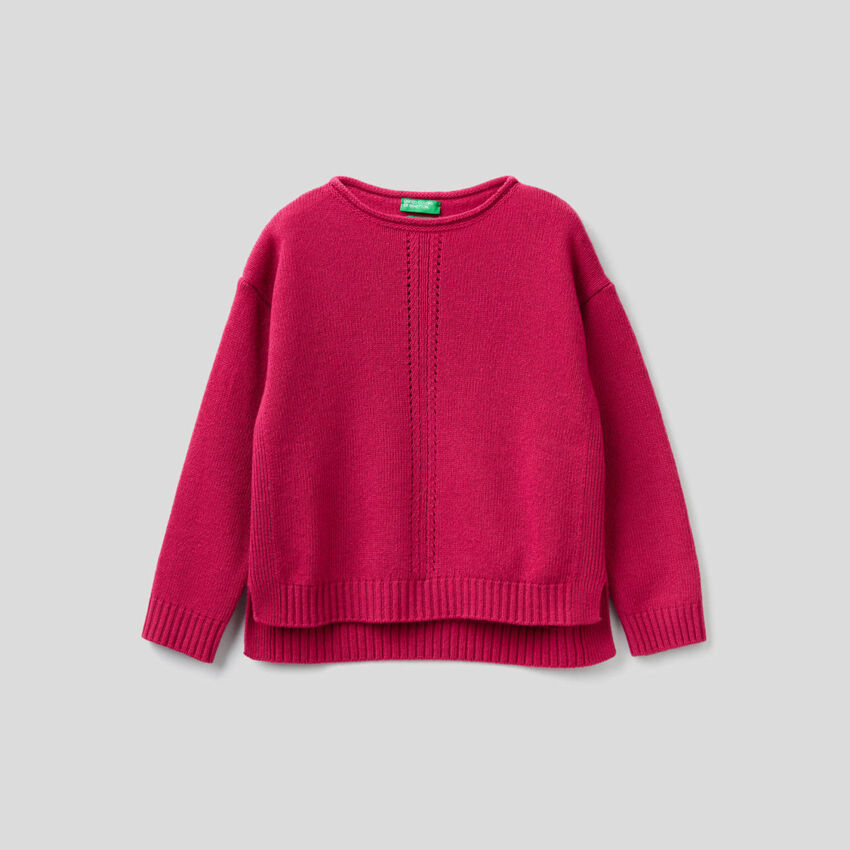 Knit sweater with playful stitching